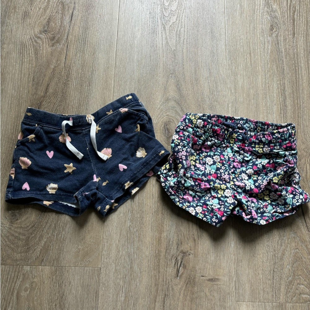 2 Carters 3T shorts. Shells pattern and floral pattern